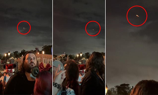 Moment 'glowing red UFO' soars over Disney World baffles ...